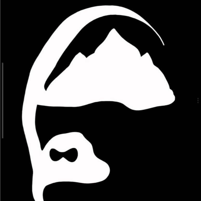White silhouette of a fish with a bow tie on a black background